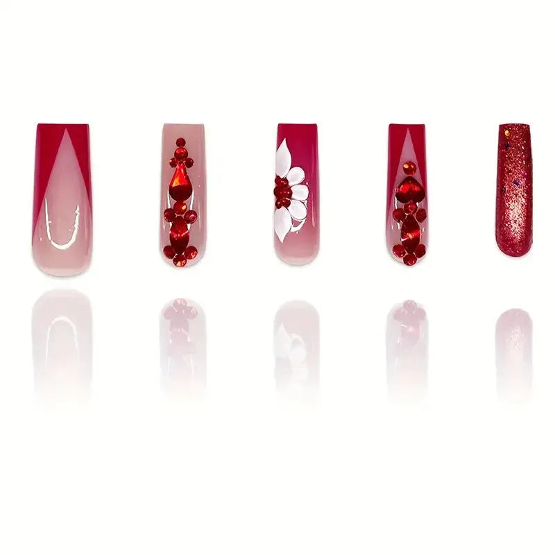 Set of sweet flower pattern press-on artificial nails with prismatic red diamonds in a long European square style.