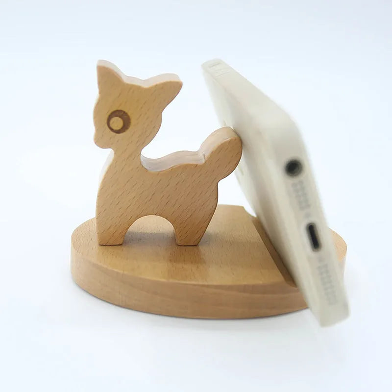 A decorative resin mobile phone stand holding a smartphone, shown in an animal design variant.
