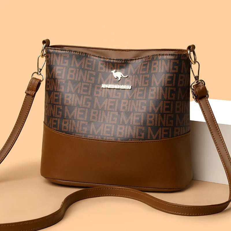 Brown retro messenger bag with soft leather texture showing interior phone and file compartments