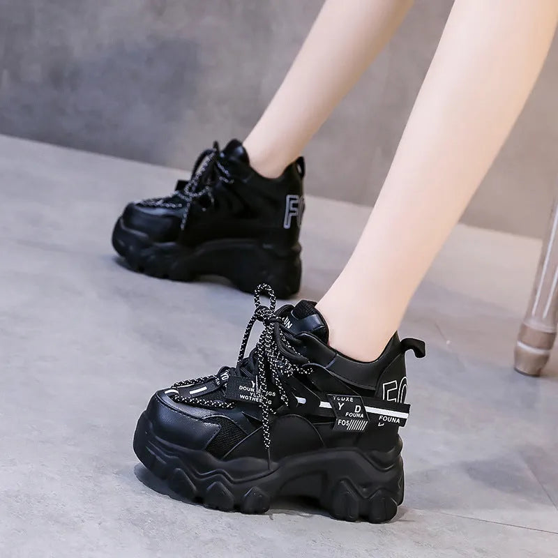 Women's white mesh platform sports shoes with cross strap and round toe on a rubber sole.