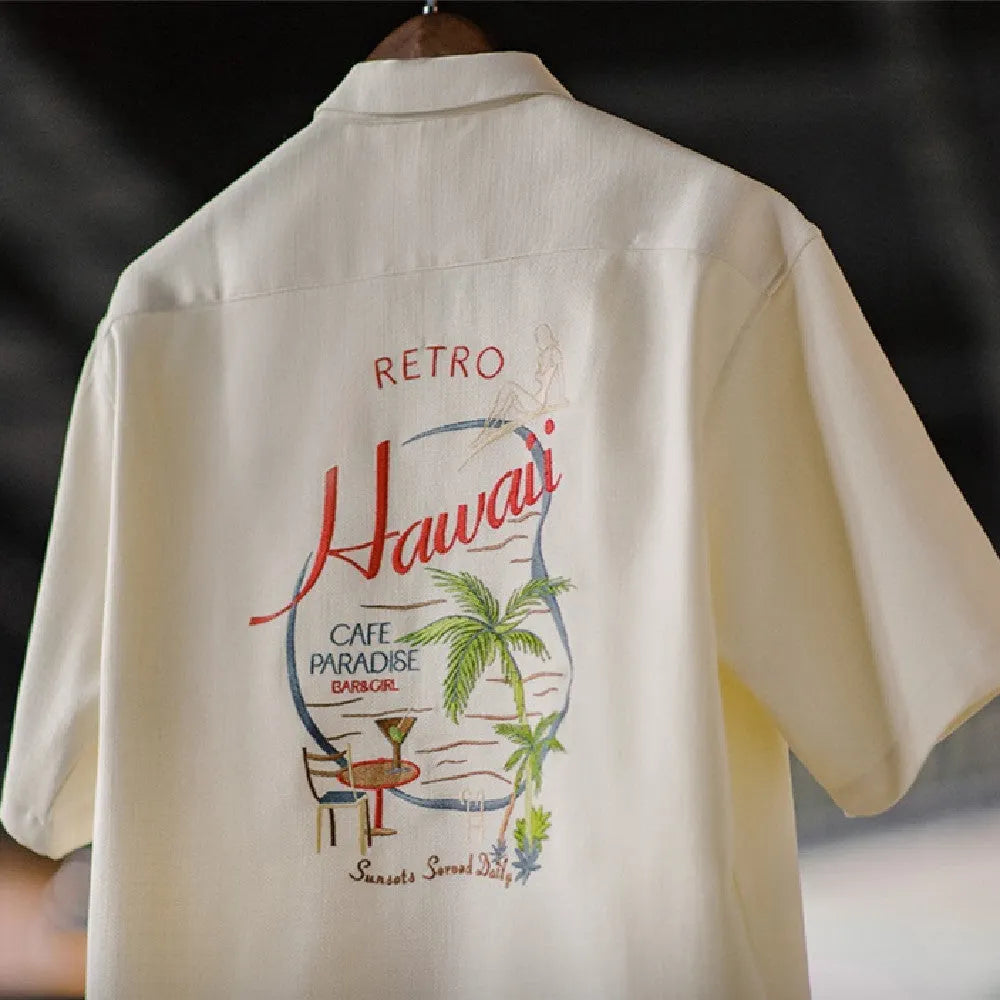 Light apricot men's shirt with bamboo floral pattern and Cuban collar.