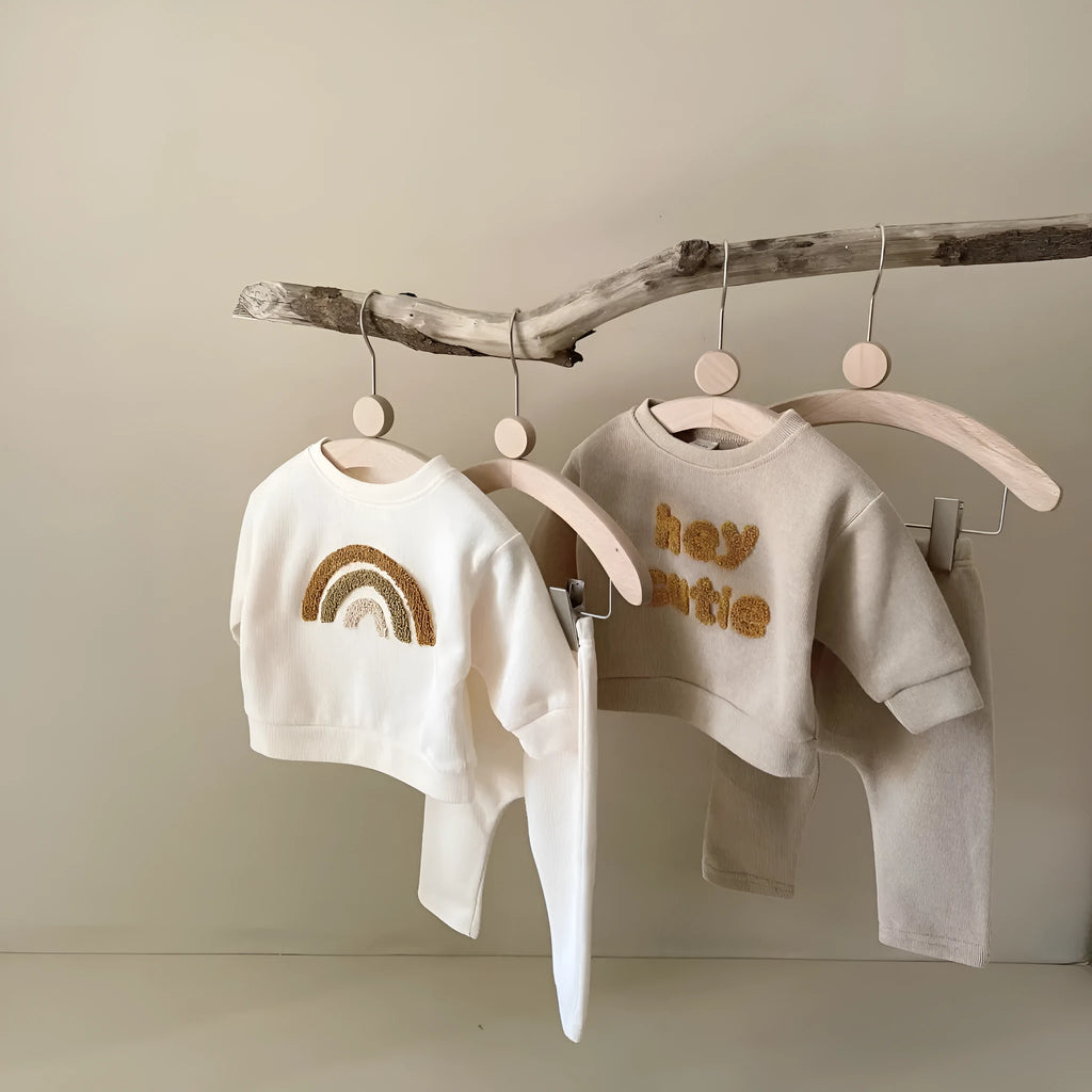 Creamy-white baby cotton two-piece suit with alphabet embroidery on long sleeve blouse and matching trousers
