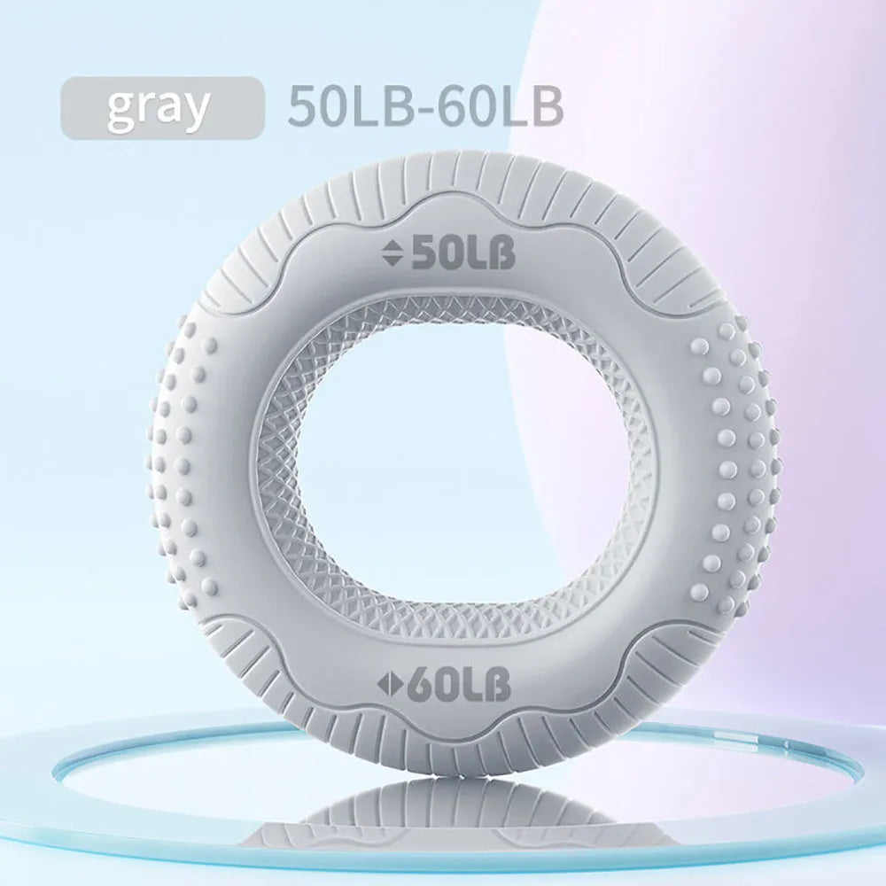 Silicone hand grip ring in five colours showing textured surface and compact 7.4cm size for finger and forearm strength training