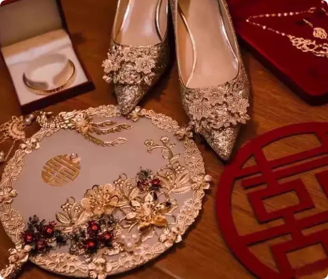 Champagne coloured women's wedding shoes with pointed toe, rhinestone details, and a fine heel.