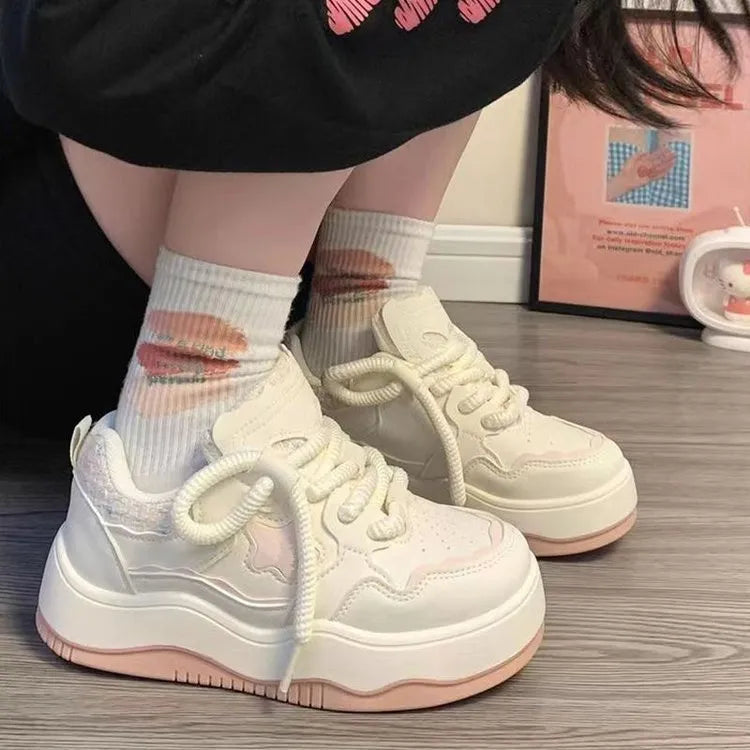 Women's green platform sneakers with round toe and lace-up closure on rubber sole