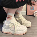 Women's green platform sneakers with round toe and lace-up closure on rubber sole