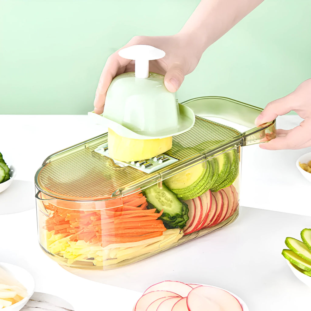 Transparent green vegetable cutter with stainless steel blades and 1.5L capacity container