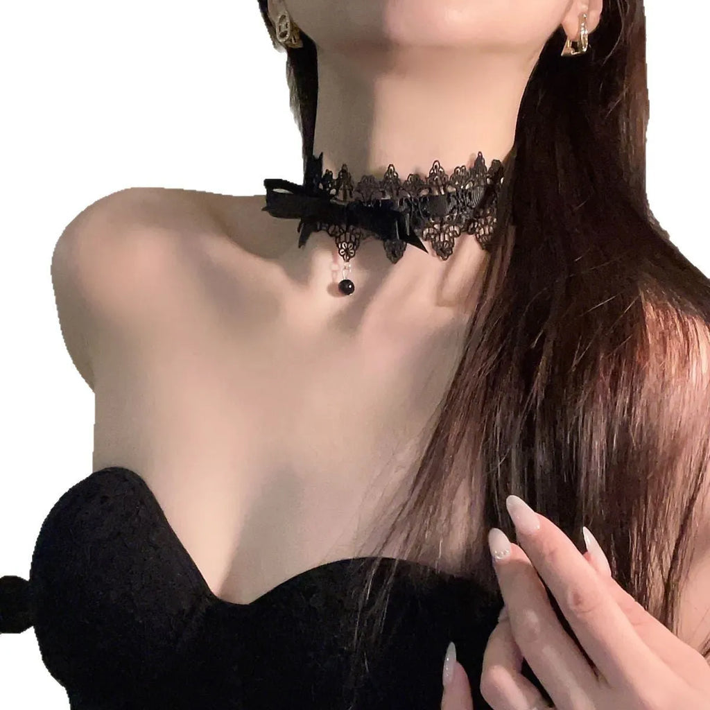 Lolita gothic bow lace choker necklace with fabric pendant and alloy chain on display