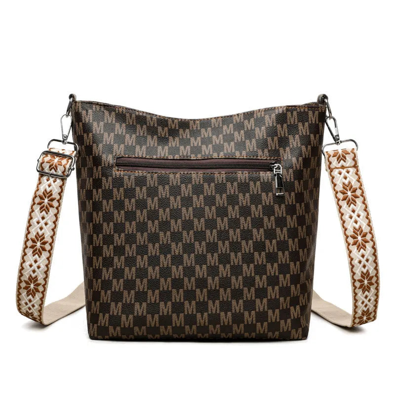 Black retro dumpling-shaped PU leather shoulder bag with an external sandwich pocket.