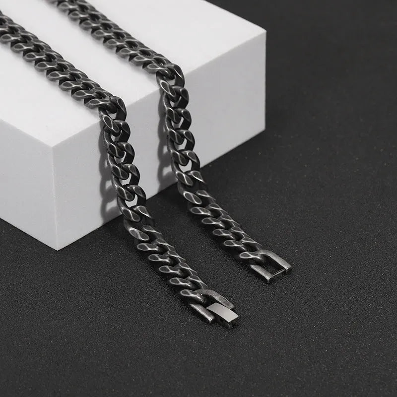 Silver titanium steel geometric minimalist cuff bracelet on flat surface showing 10mm width