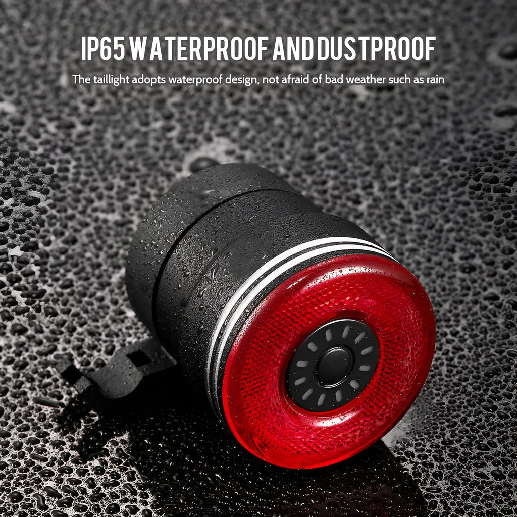 Black aluminium alloy smart bicycle tail light showing USB port and brake-sensing sensor.