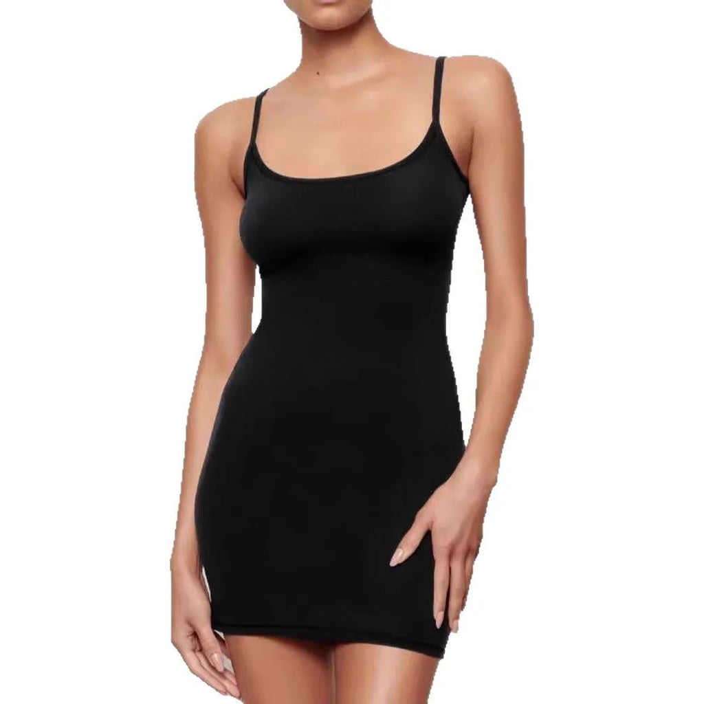 A black sleeveless sling dress with a skinny sheath fit and short skirt.