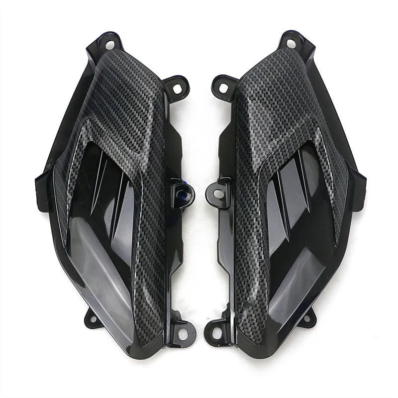 Pair of YAMAHA NMAX side replacement lamps with LED lights and carbon fibre pattern, showing blue illumination option.