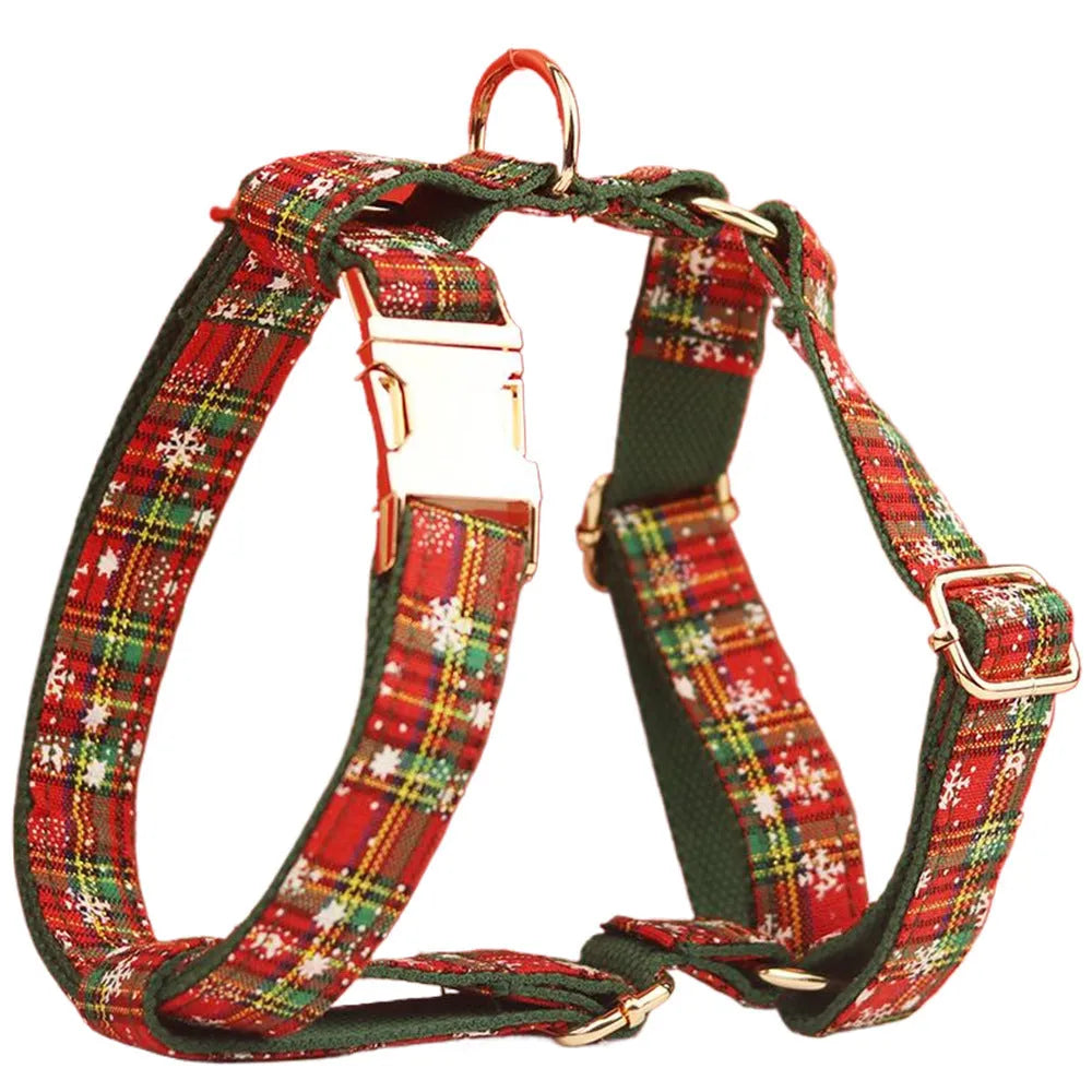 Christmas pet collar four-piece set with green background snowflake design showing dog collar, leash, vest and matching bow