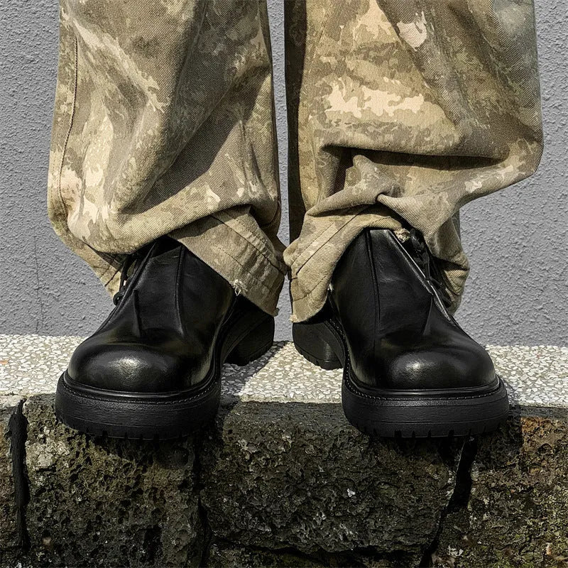 Black platform leather shoes with round toe and low top upper on a rubber sole