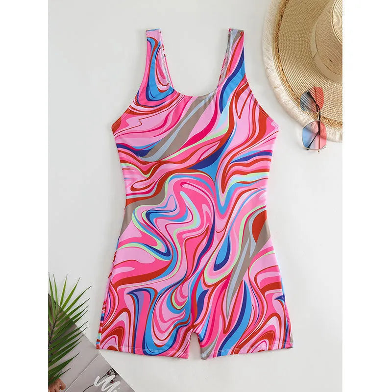 A woman's printed one-piece swimsuit with a high-waisted and backless design on a mannequin.