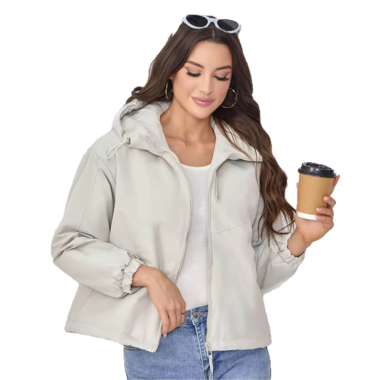 Grey loose-fit women's hooded shell jacket with long sleeves on a hanger.
