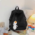 Large capacity nylon backpack in Japanese Harajuku style for female college students, vertical square shape 28x45x13cm, solid colour black, with pendant