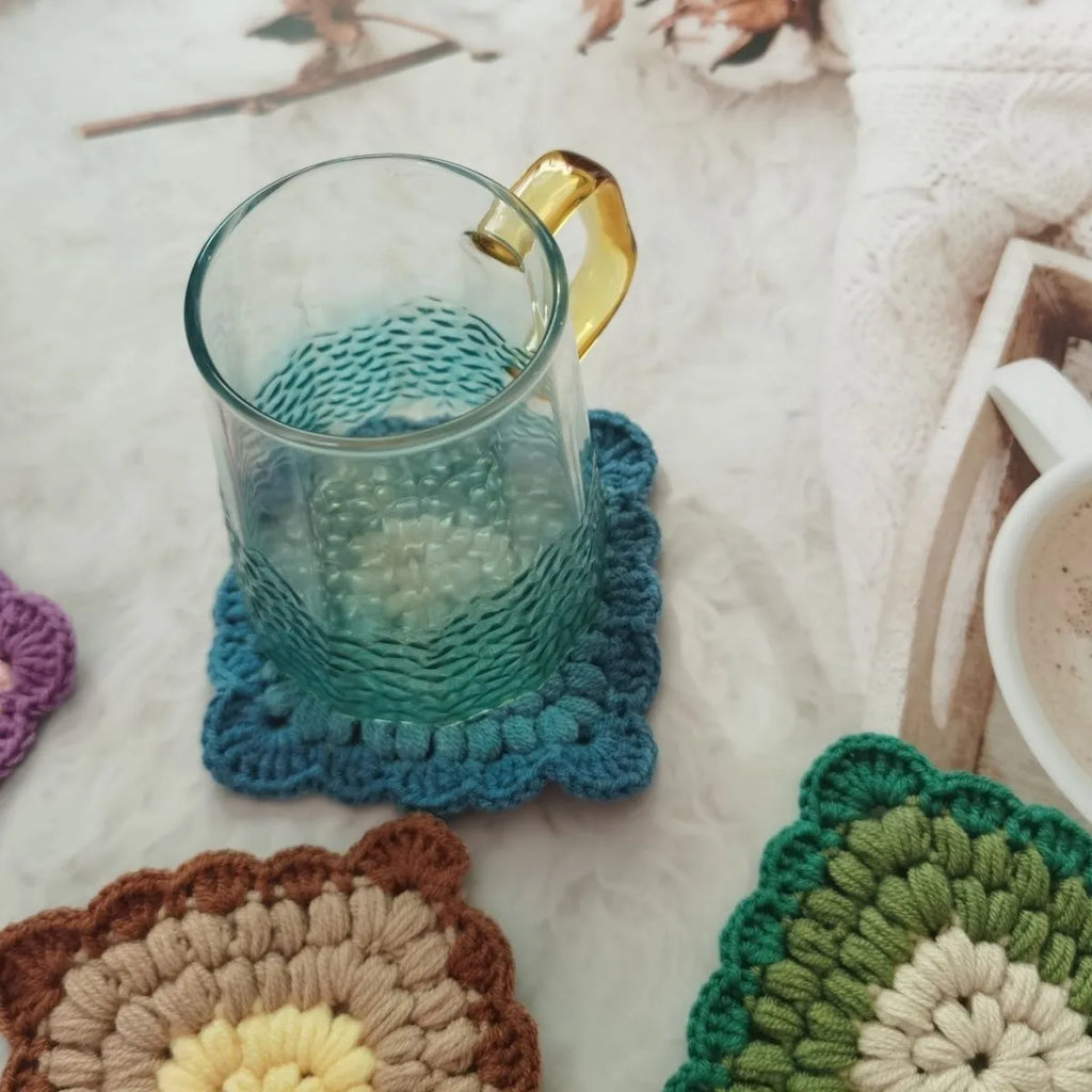Crocheted wool cup placemat with Grandmother Lattice pattern in chosen colour