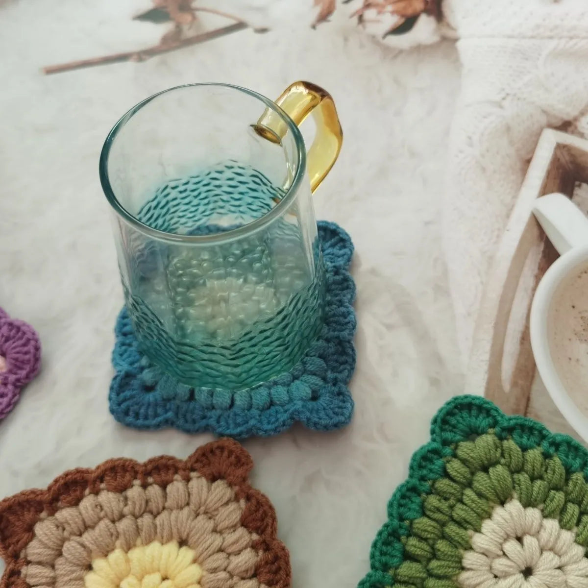Crocheted wool cup placemat with Grandmother Lattice pattern in chosen colour