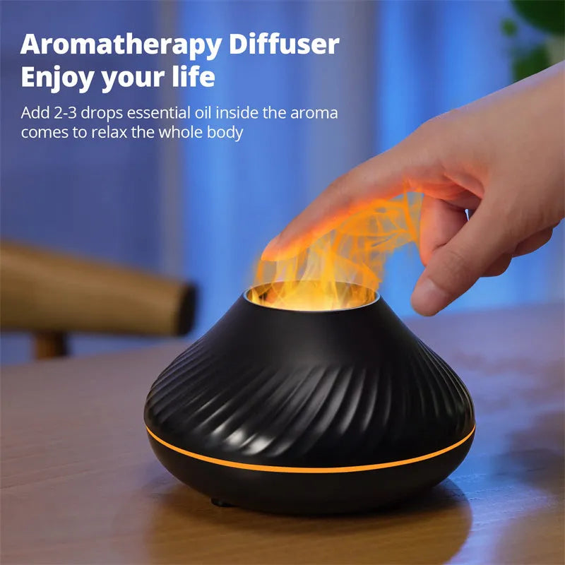 Beige volcanic flame aroma diffuser with LED light on a wooden table next to an essential oil bottle