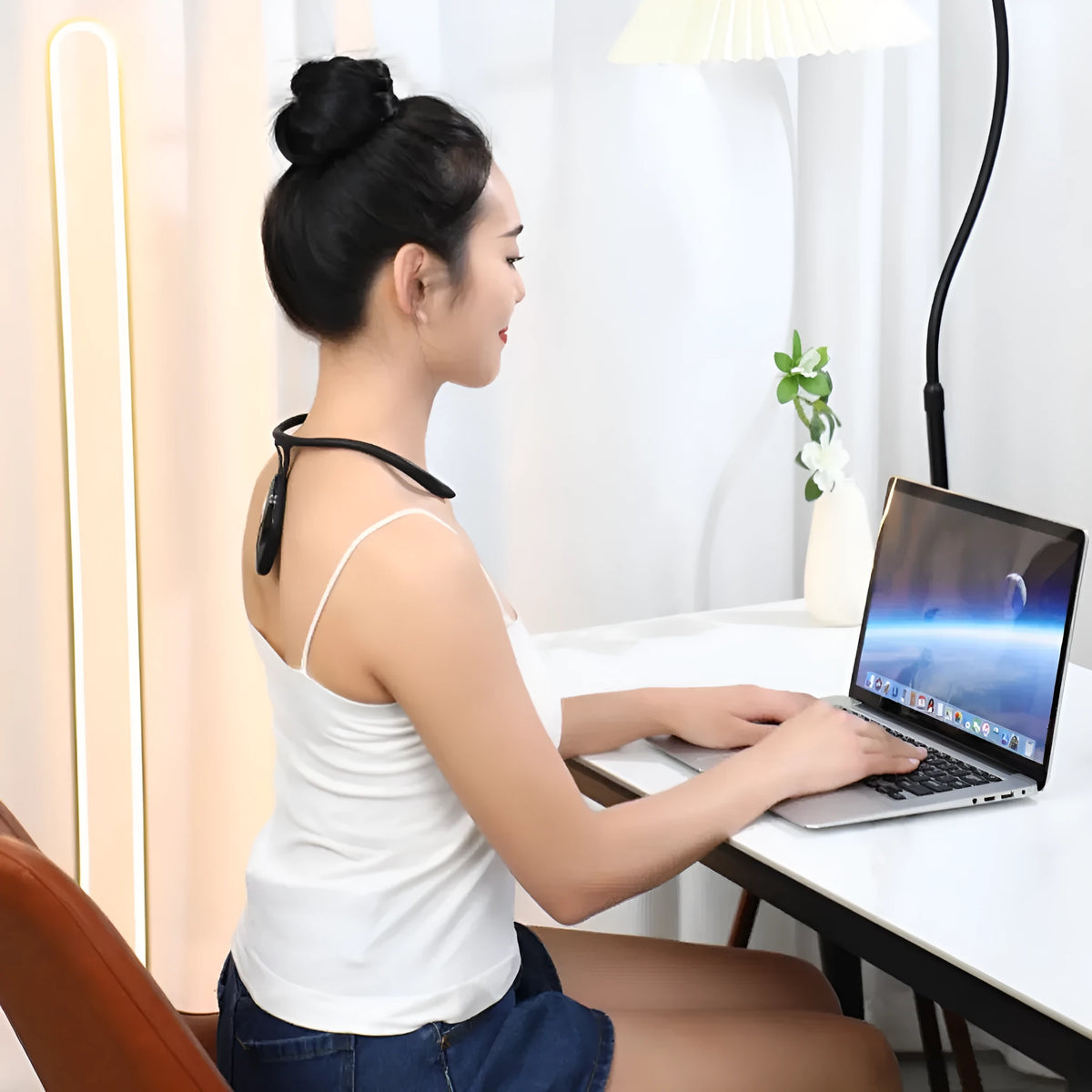Children's portable posture corrector with LCD display, vibration reminder, USB charging, in black or orange.
