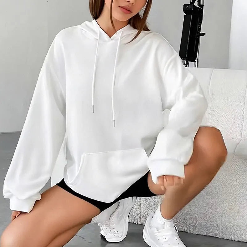 Women's loose grey hooded sweatshirt with a front pocket and drawstring.