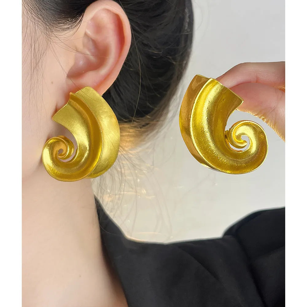 Retro geometric ear studs in gold or silver finish measuring 5cm with alloy construction