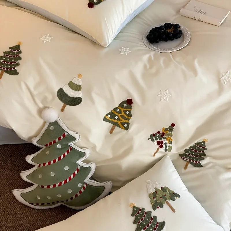 Cream blue duvet cover with raised towel embroidery Christmas tree design, part of a pure cotton four-piece bedding set.