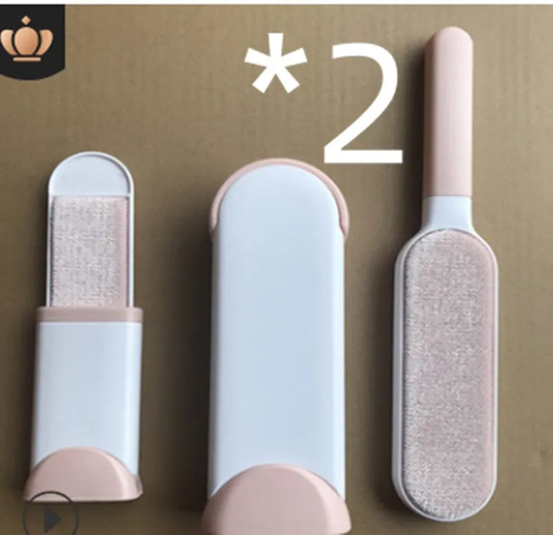 Blue reusable pet hair removal comb with double-sided brush next to its self-cleaning base.