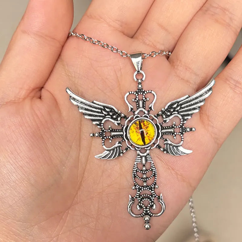 Geometric alloy pendant necklace featuring detailed devil wings and a cross, shown in multiple colour options.