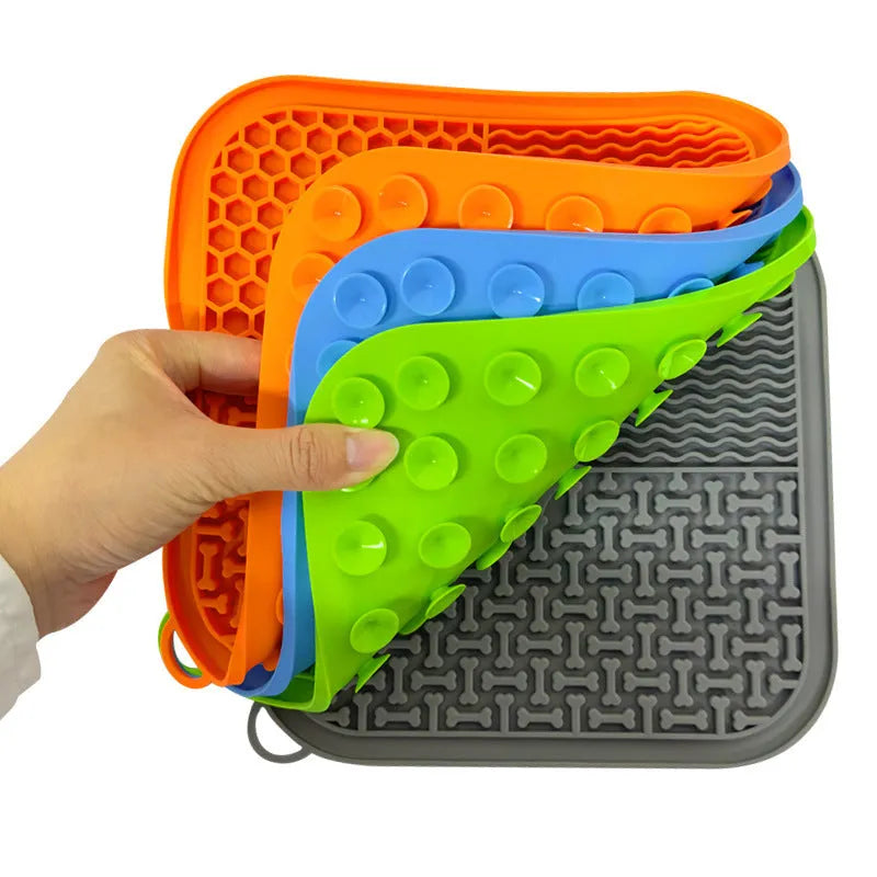 Fengrong silicone slow food bowl in sky blue on a non-slip surface with a scraper alongside