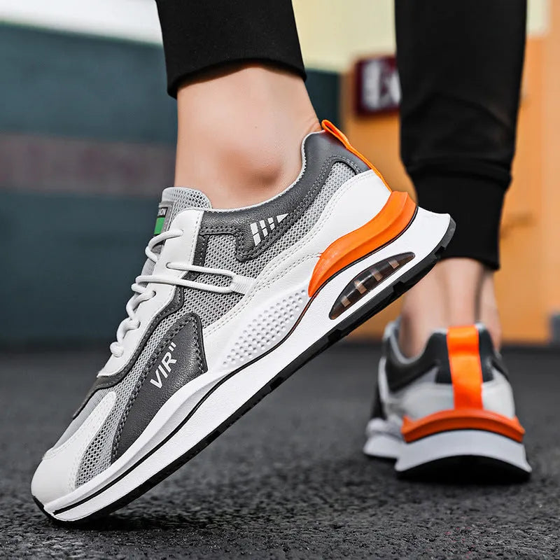 Men's grey and black mesh running shoes with EVA sole and sewing thread detail on a white background.