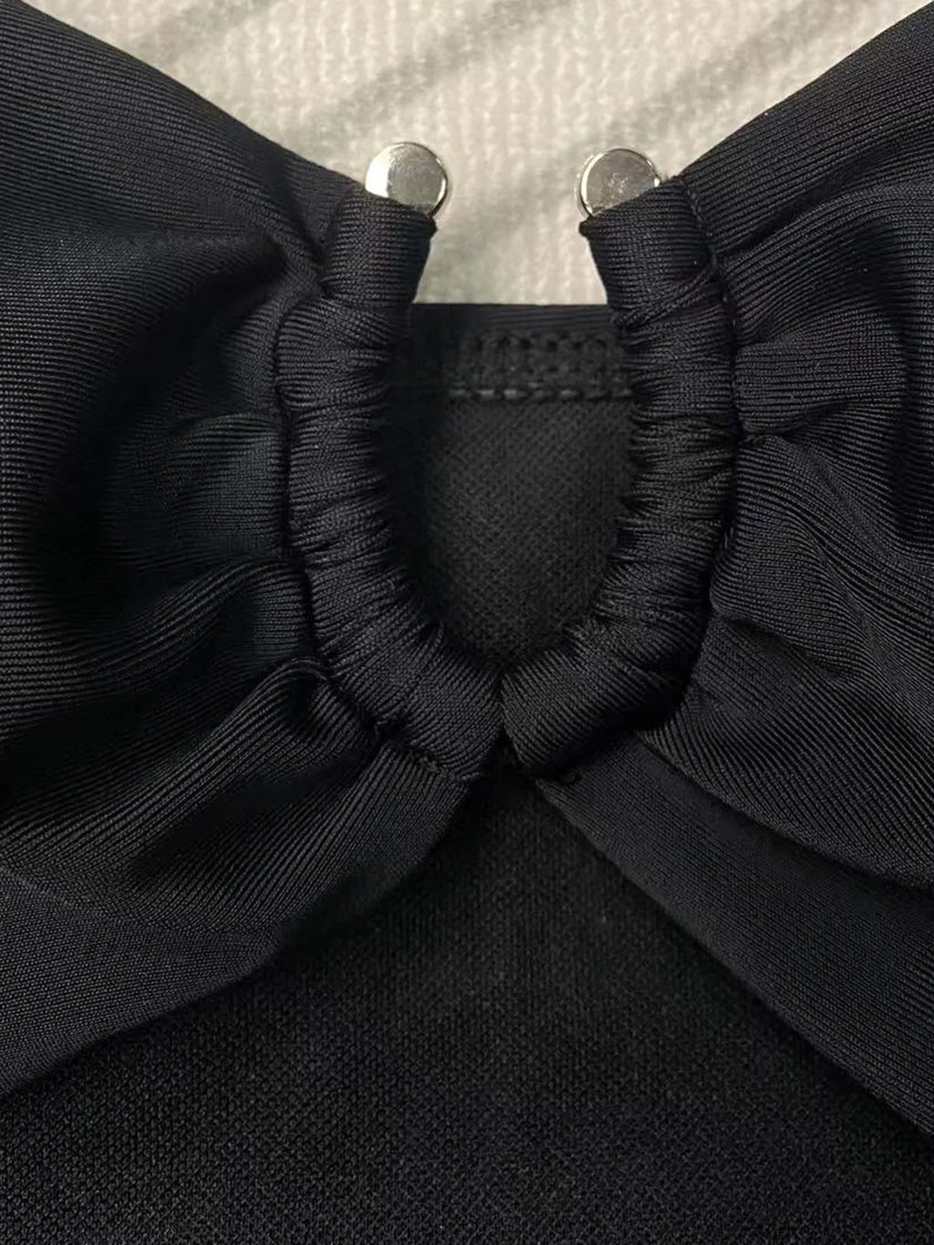 Solid black one-piece swimsuit for women on a mannequin.