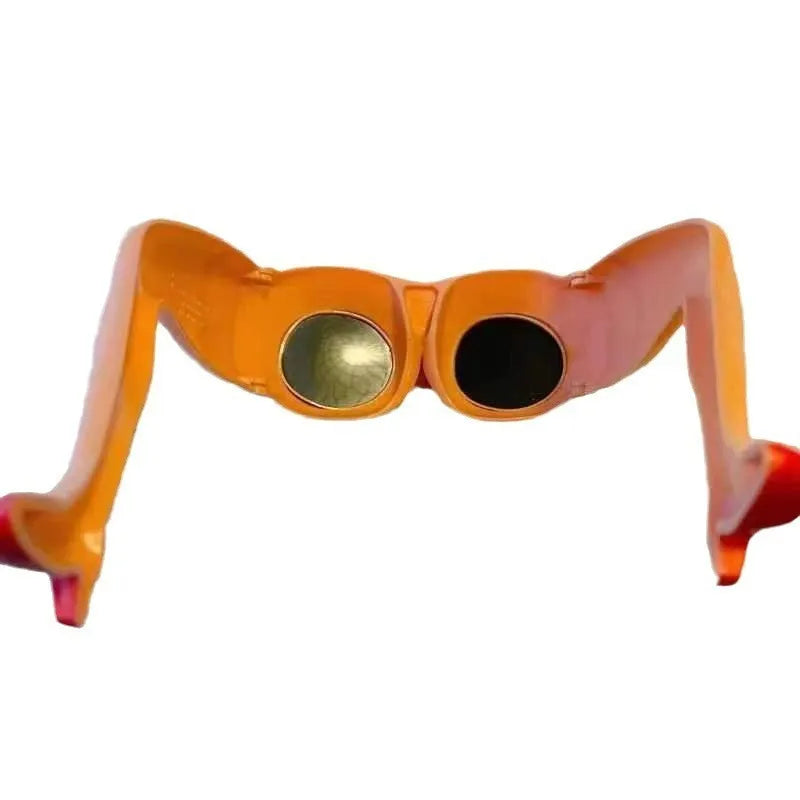 Orange novelty sunglasses with a unique leg-hip frame design, shown from the front. Oversized 15cm by 20cm dimensions.