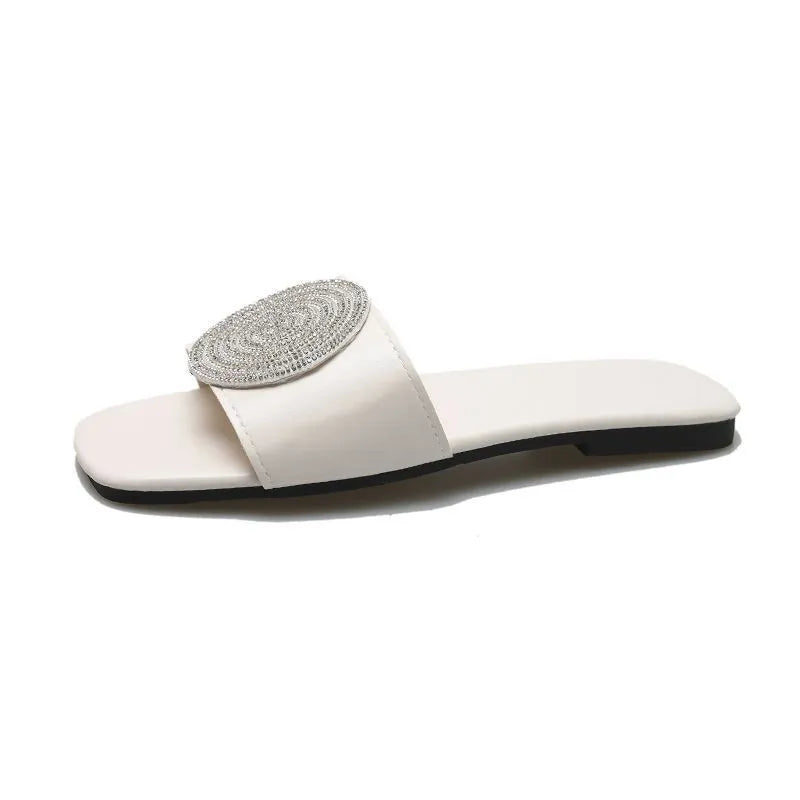 Open toe PU slippers with rhinestone decoration, available in black, white, and gold colours, sizes 36 to 43