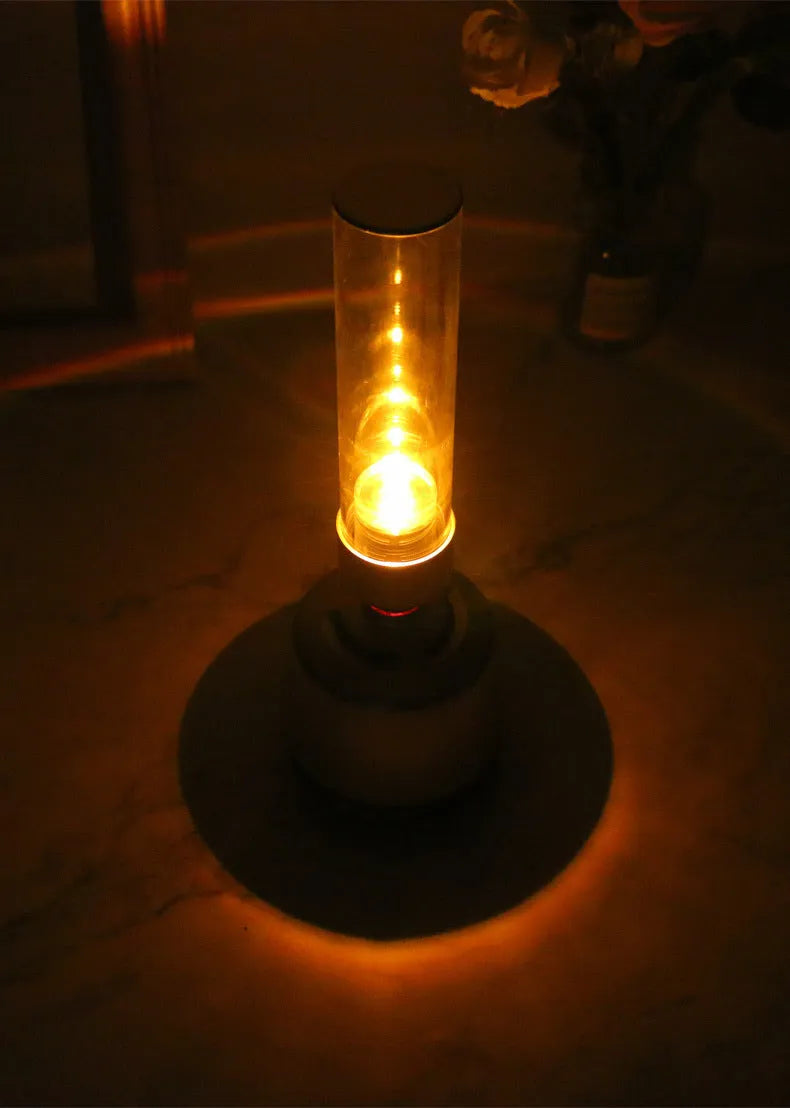 White silver candlelight Bluetooth speaker and LED night light with modern design.