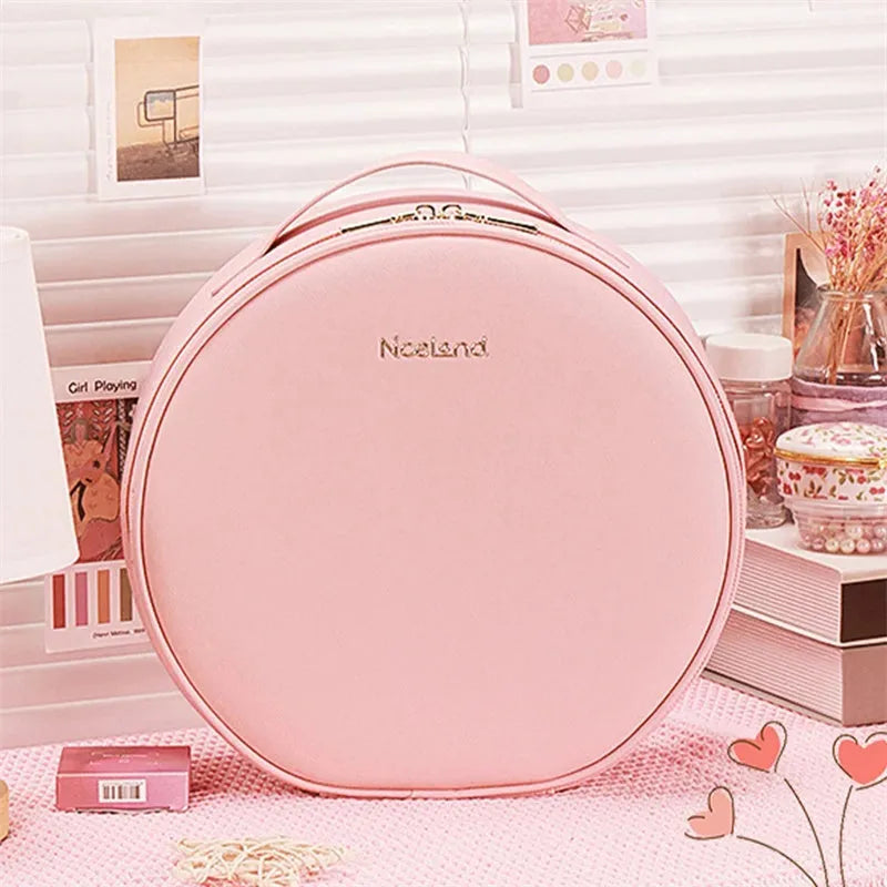 Round black smart LED makeup bag with lighted mirror open, showing internal partitions.