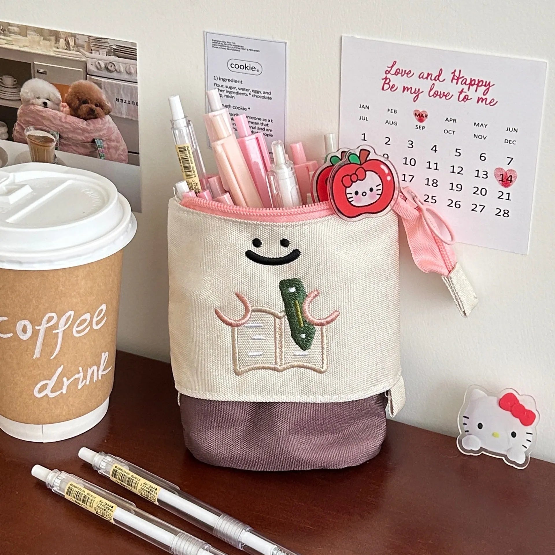 Brown collapsible pencil case with cartoon design, shown open and closed