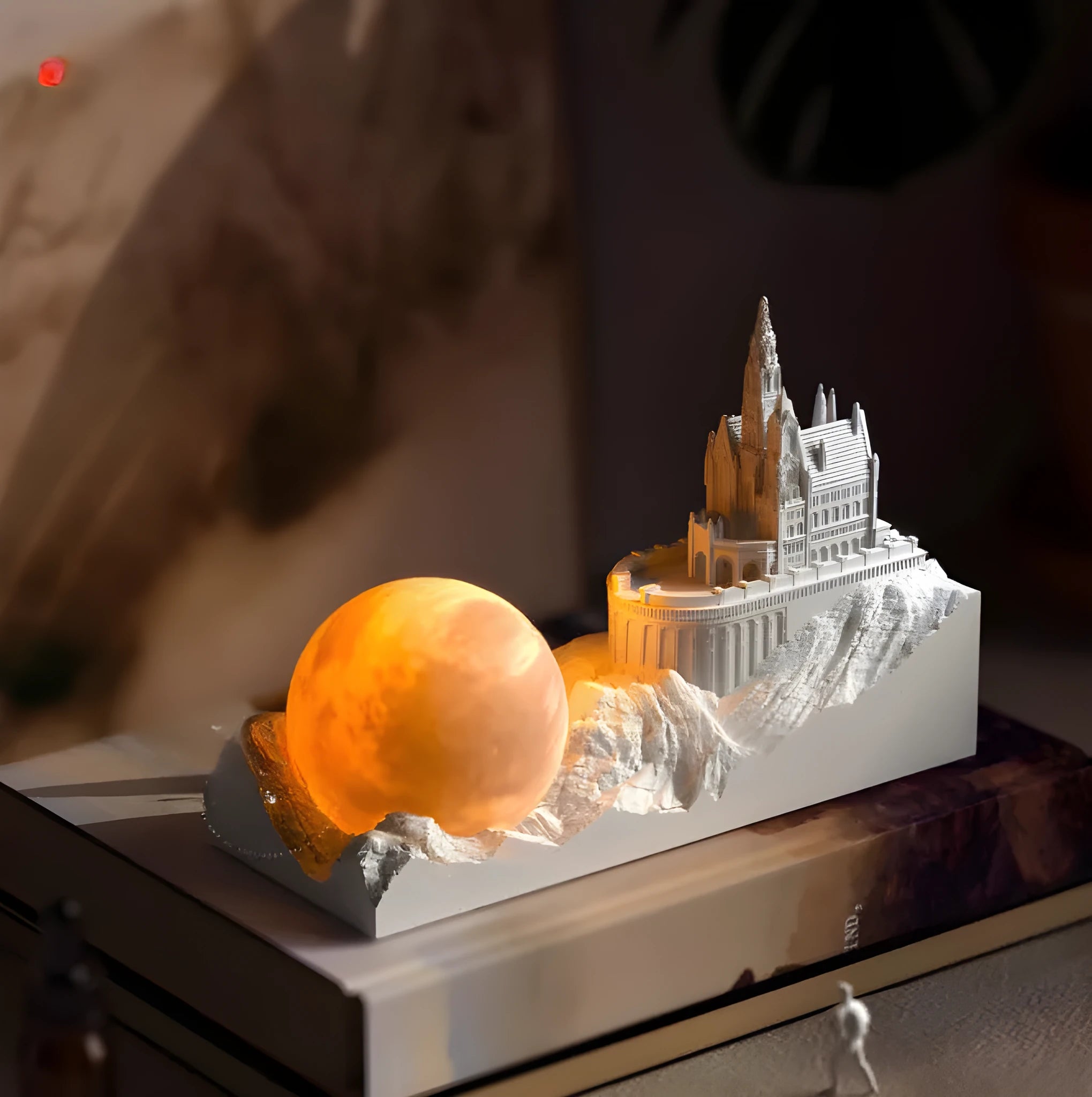 Mountain-shaped aromatherapy night light with touch control, LED lamp, essential oil and card gift set on a desk