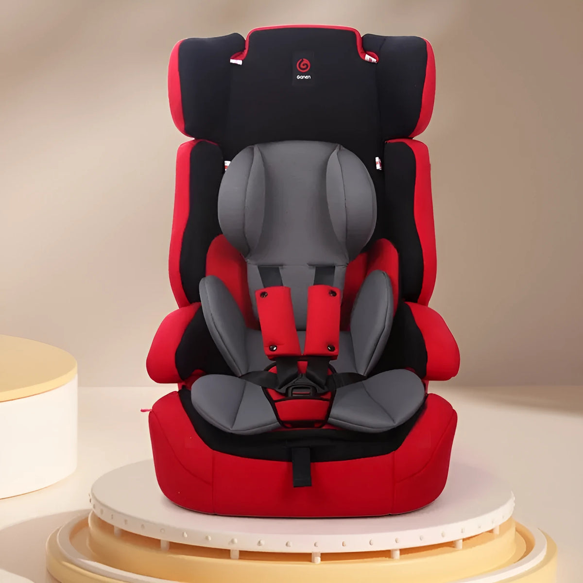 Children's safety seat cushion with waist support and head protection pad in knitted fabric and sponge, shown in assorted colours.