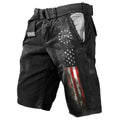 Man wearing loose grey shorts with a 3D digital print pattern in a college style.