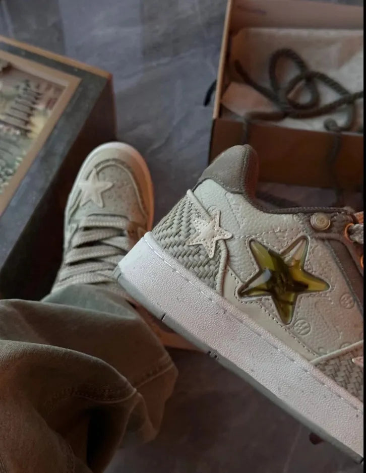 Green low-top casual shoes with star pattern, round toe, and thick rubber sole.
