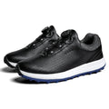 Men's white low-top golf shoes with breathable mesh upper and anti-slip sole on golf course