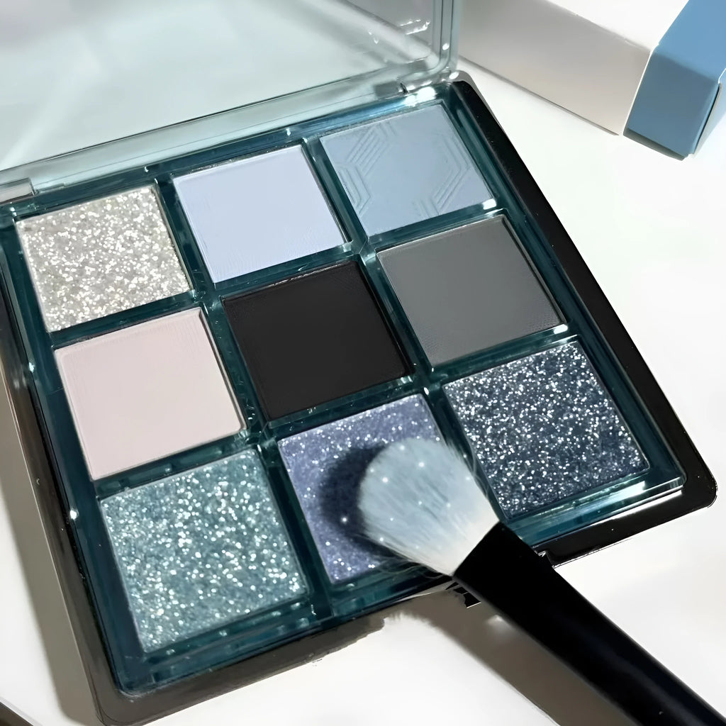 MUGELEEN nine-colour eye shadow palette showing matte and shimmer finishes in low saturation tones
