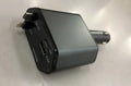 Automatic retractable cable car charger plugged into a vehicle cigarette lighter socket.