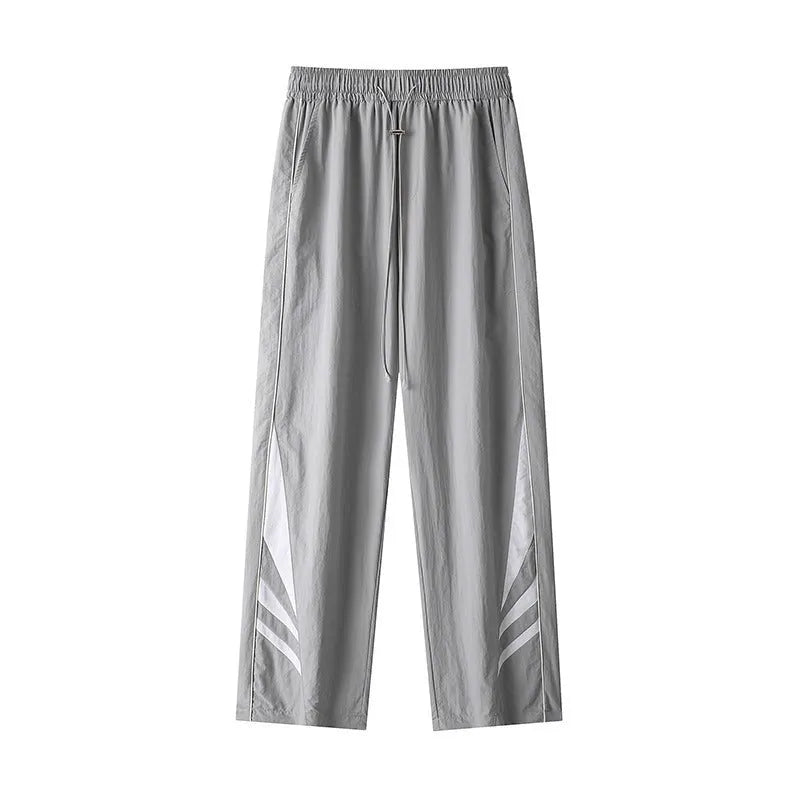 A pair of black straight-leg men's casual trousers on a hanger, showing the mid-rise waist and non-ironing fabric texture.