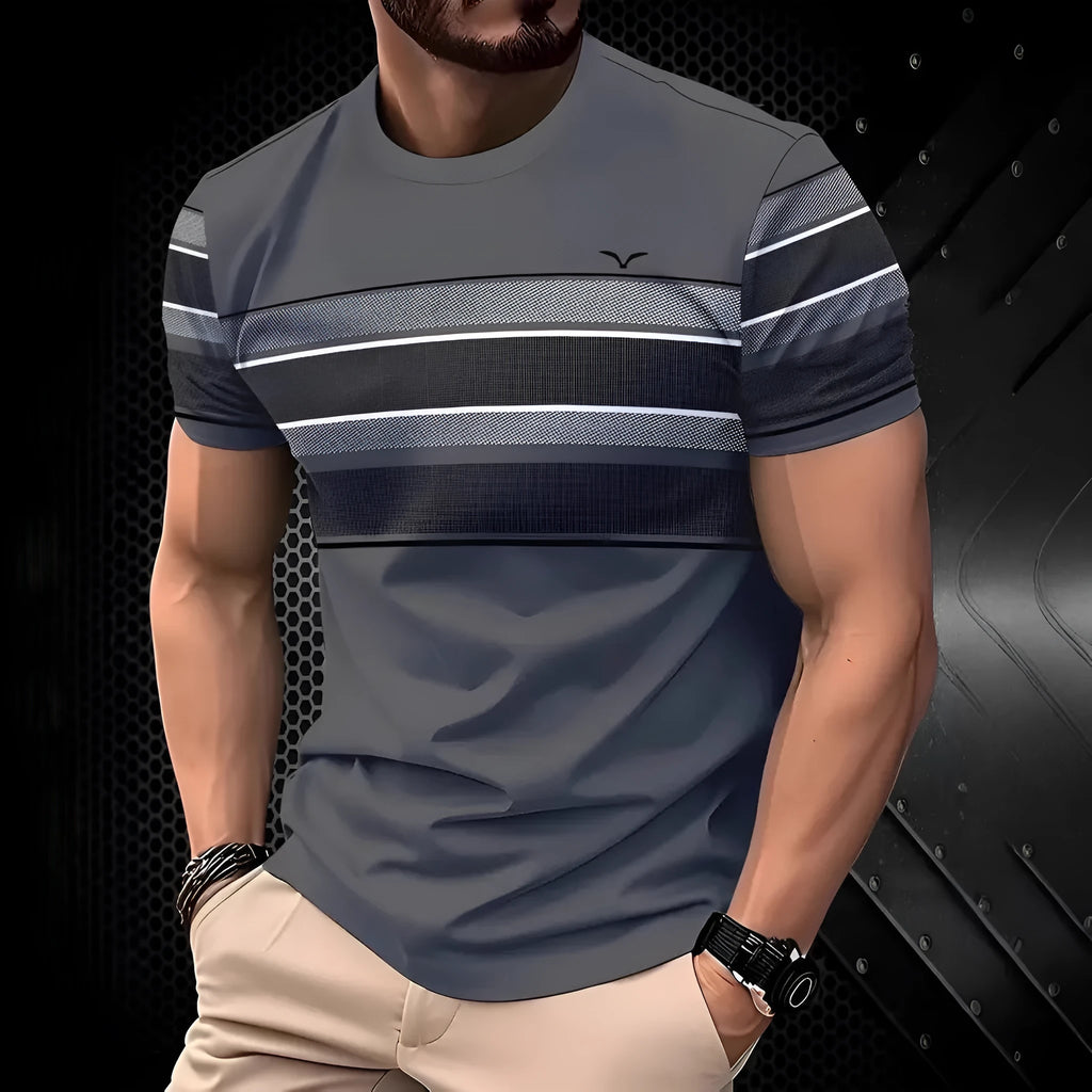 Man wearing a loose fit grey short sleeve polyester T-shirt on a casual summer day.