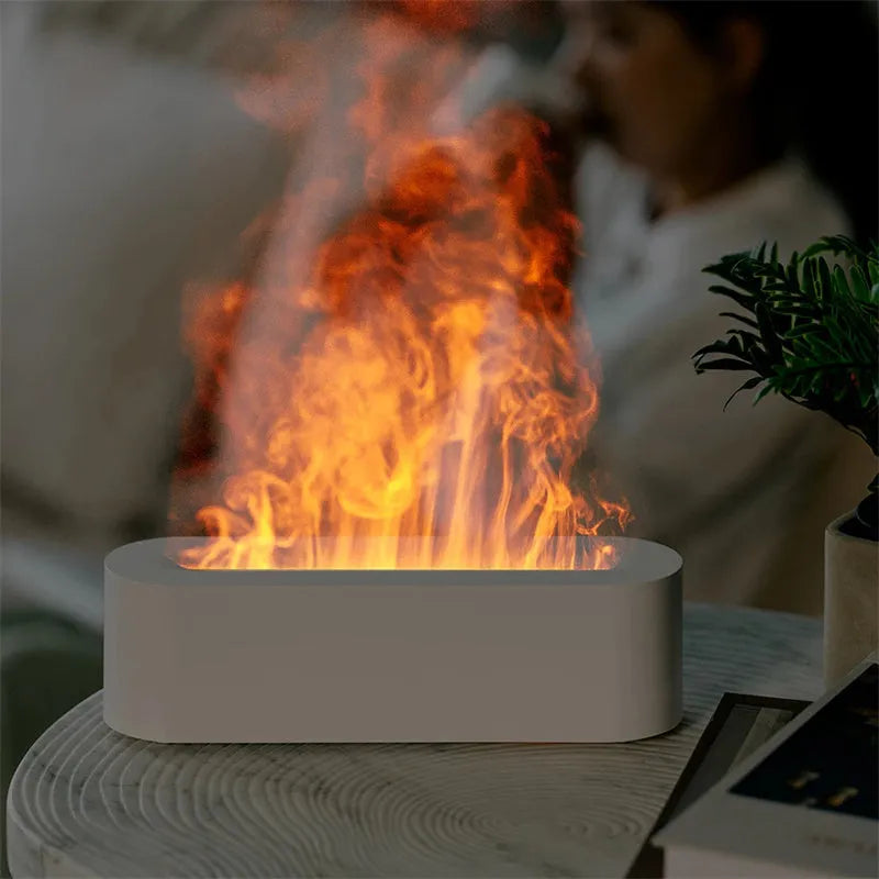 White square plastic flame aroma diffuser humidifier with LED lights and water vapour mist.