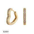 Gold plated heart-shaped ear clip earrings with zircon gang drill details on a white background.